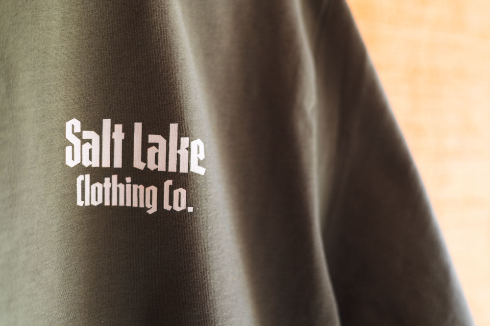 A closeup of the Good Company Pocket Logo T screen-printed graphic